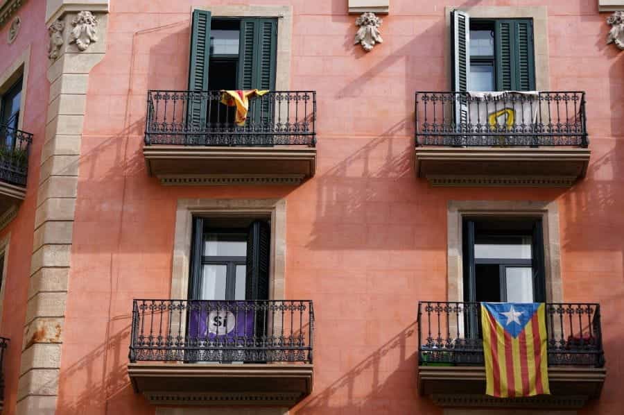 The outside of a red apartment building in Barcelona, Spain.