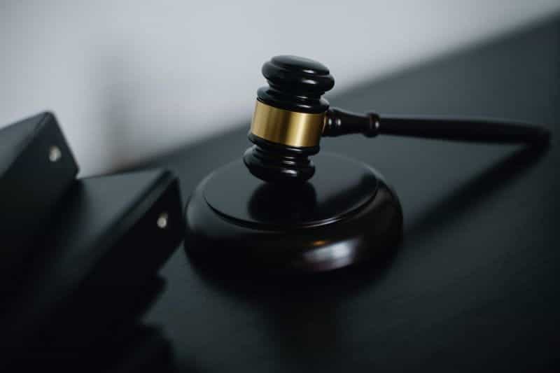 A black and gold wooden judge's gavel.